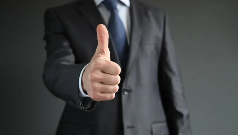 a guy giving a thumbs up